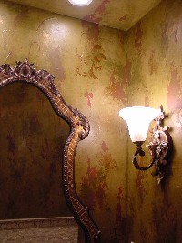 Layered texture, crackle, and several glazes with metallic design